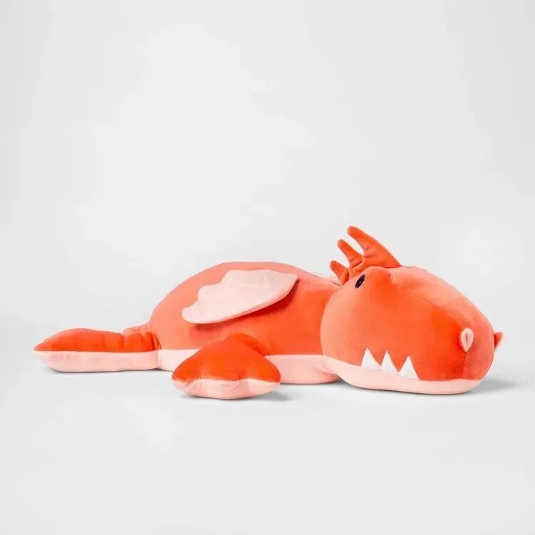 Plush toy resembling a red dragon 