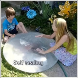 Two children interacting with a large bubble labeled 'Self sealing' in a garden setting.