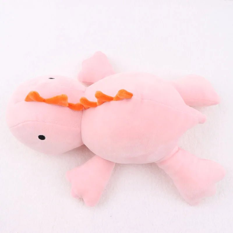 Pink plush toy with orange accents 