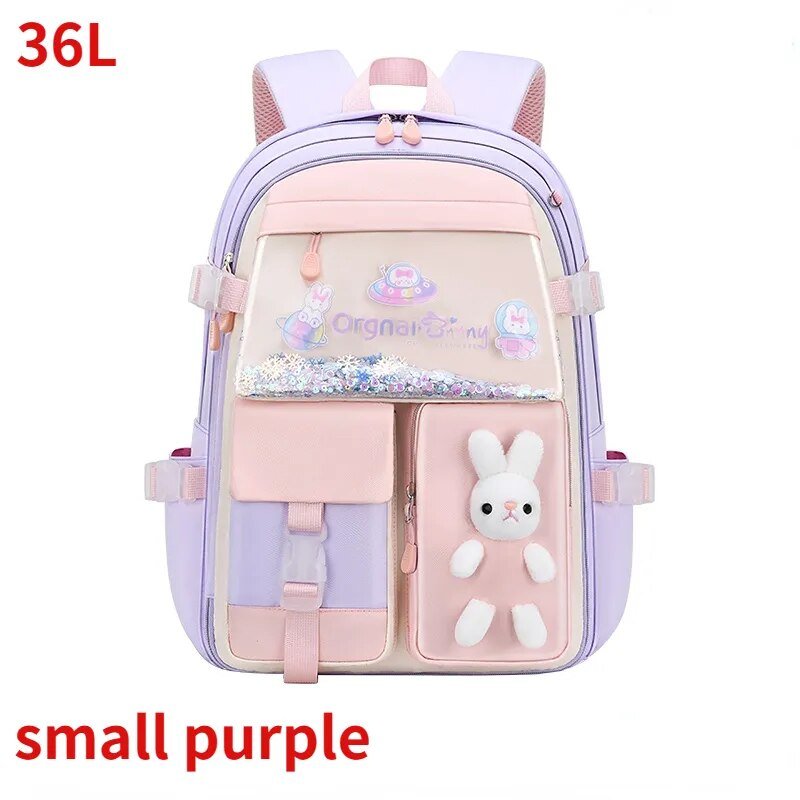 Pink and purple backpack with a bunny plush toy 