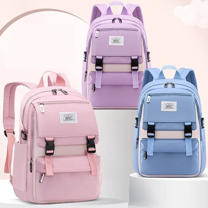 Three colorful backpacks in pink, purple, and blue.