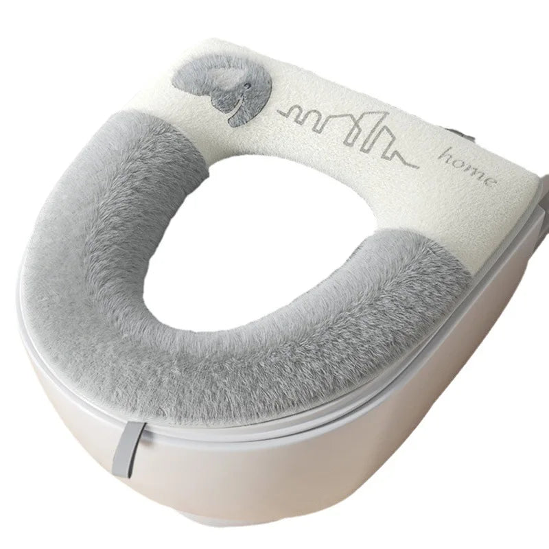 Gray toilet seat cover with 'home' branding on a white background