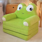Green inflatable chair with a cartoon face on a light-colored floor.