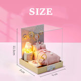 Pink plush toy and lamp set in a clear box with dimensions on a pink background
