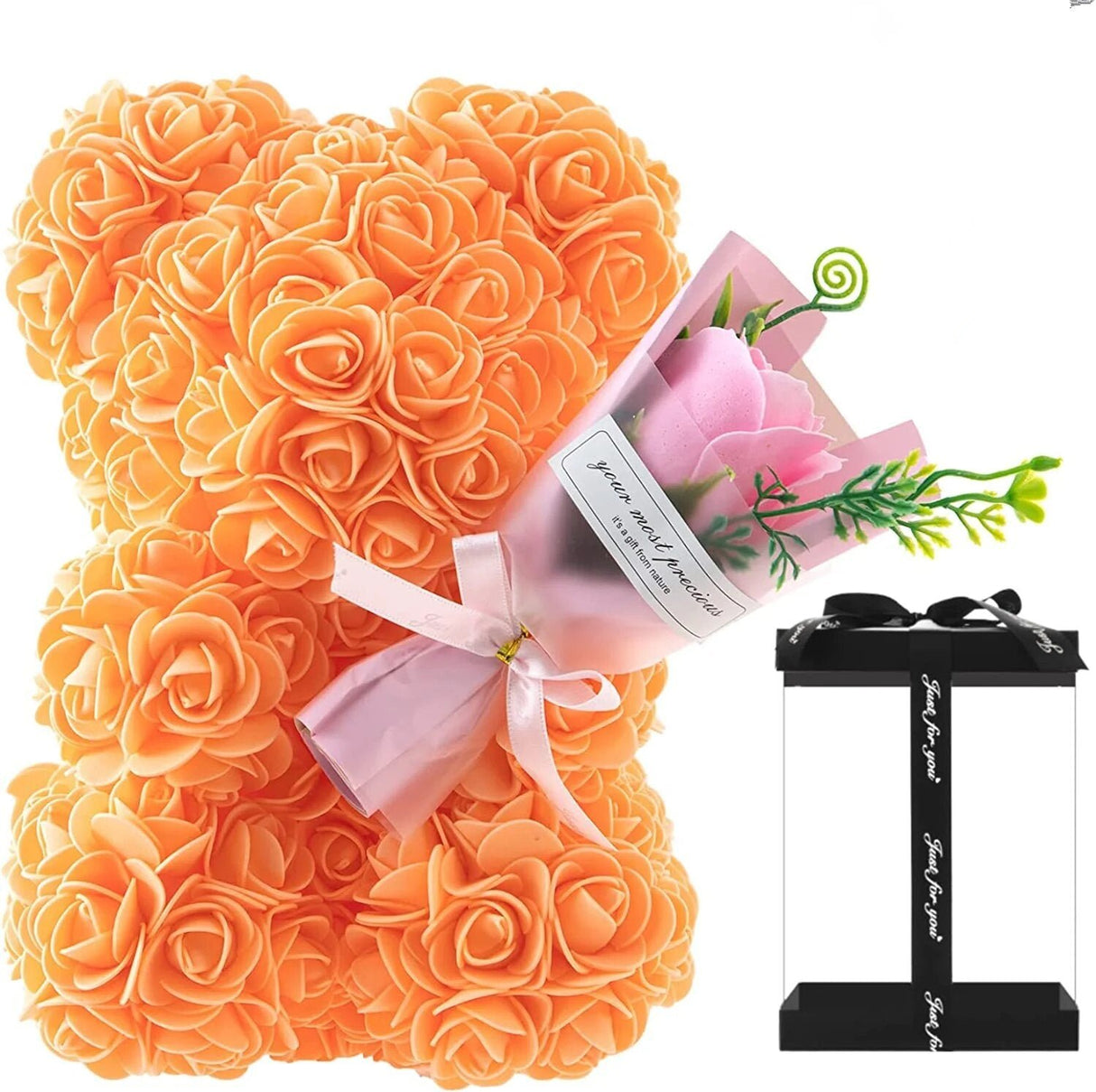 Orange rose-shaped gift with a pink bow and a small bouquet of flowers.