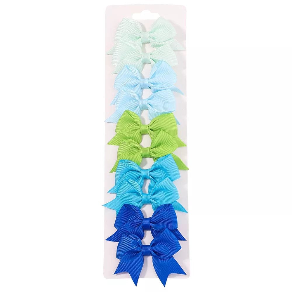 Set of colorful hair bows on a white background