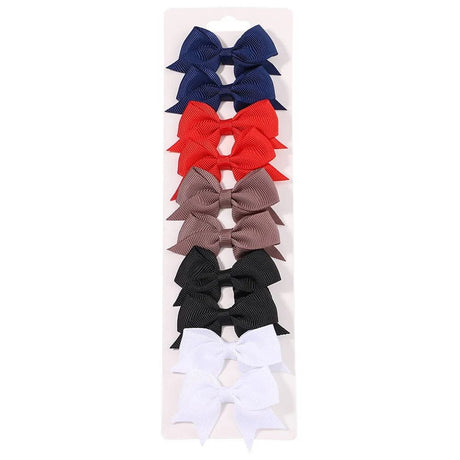 Set of colorful hair bows on a white background