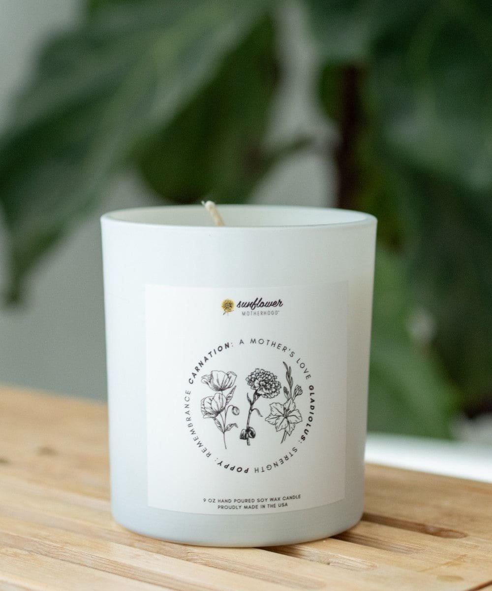 White candle with floral design