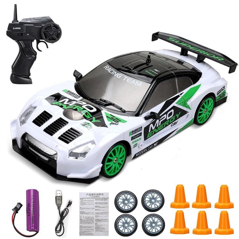 Toy race car with remote control, wheels, and cones.