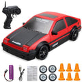 Red and black RC car with remote control, batteries, and accessories.