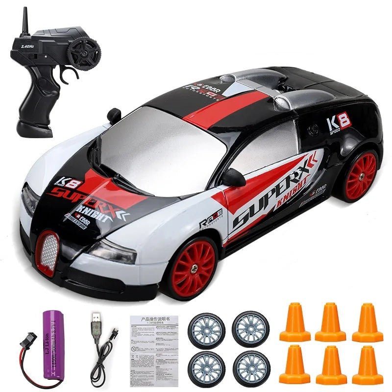 Toy race car with remote control, wheels, and cones.