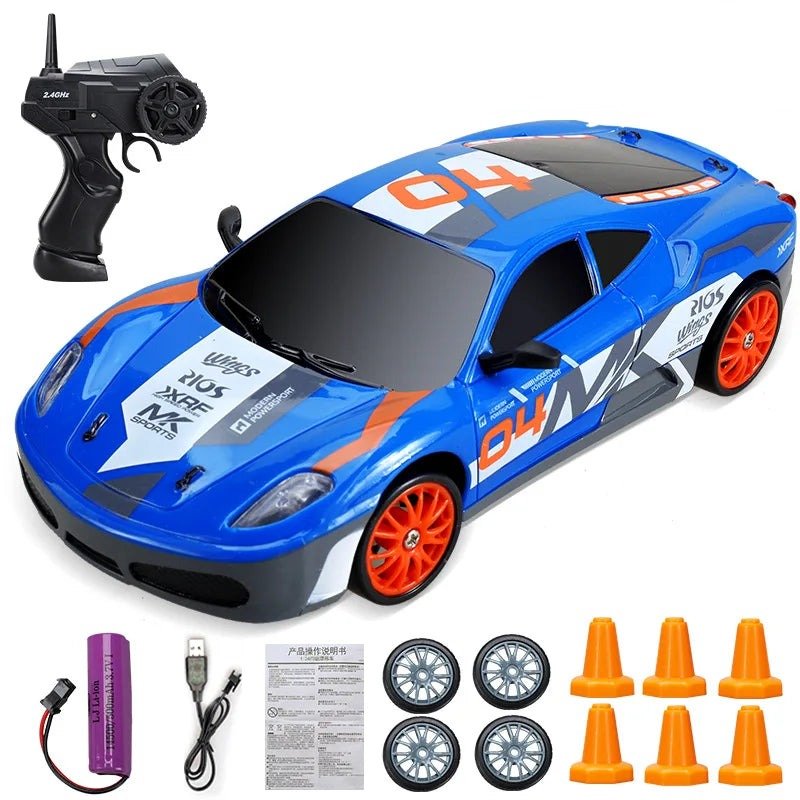 Blue toy race car with remote control, wheels, and cones.
