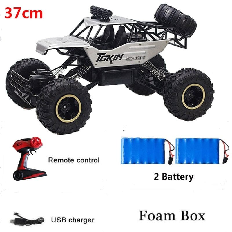Toy truck with remote control, batteries, and USB charger