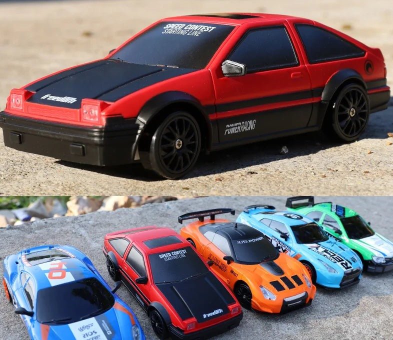 Collection of toy cars with racing decals on a textured surface