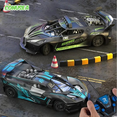 Two remote-controlled cars on a track with a person holding a remote control.