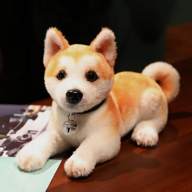 Plush toy dog with a bell on a wooden surface