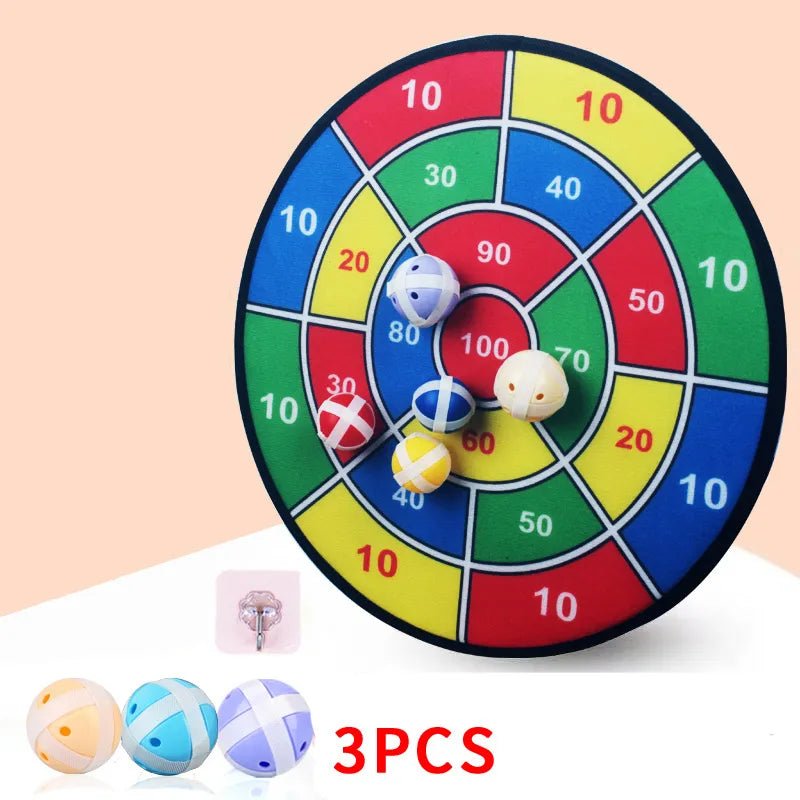 Colorful dartboard game with three darts on a light pink background