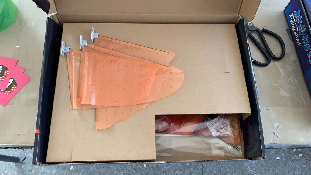 Open a cardboard box with the product.