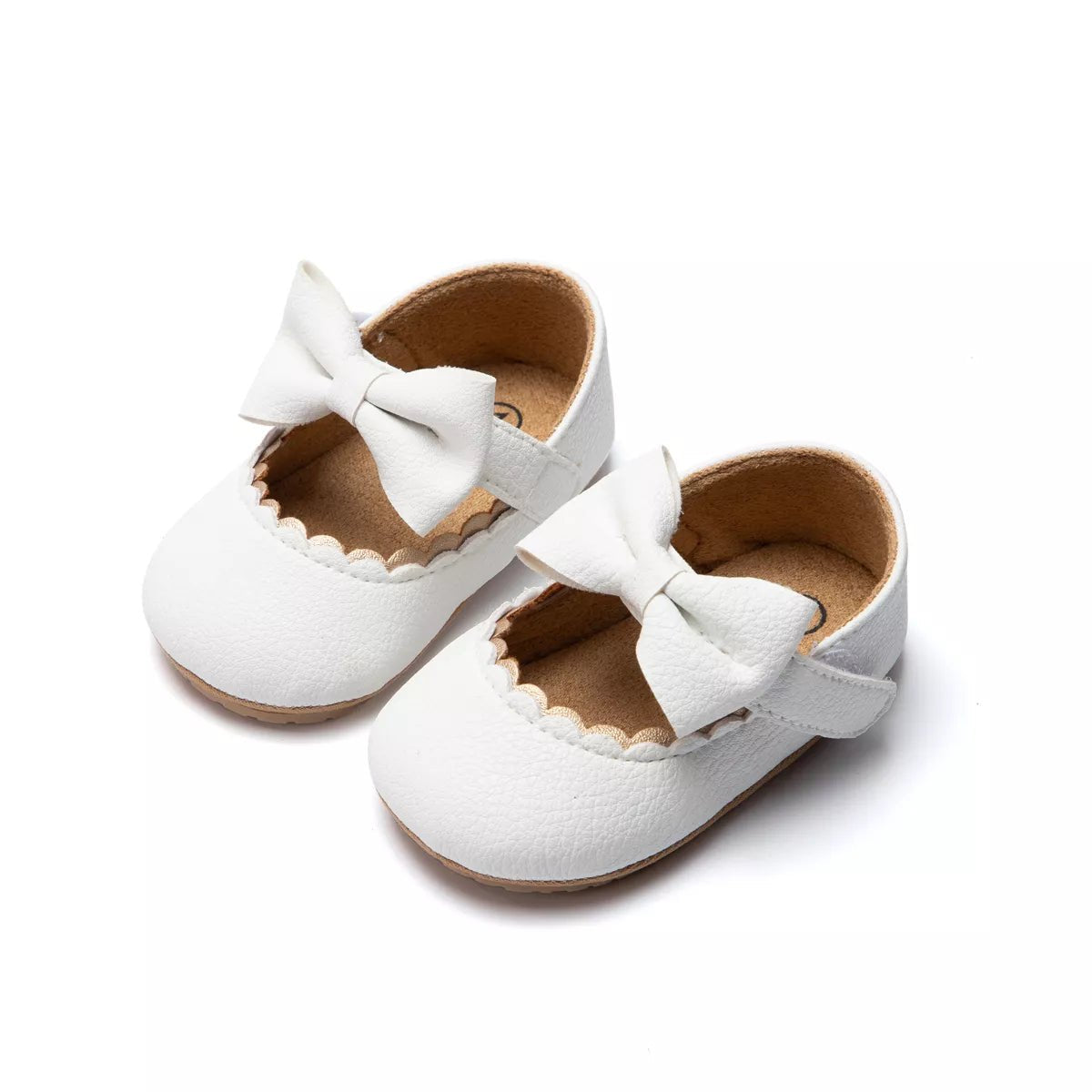 White baby shoes with bows