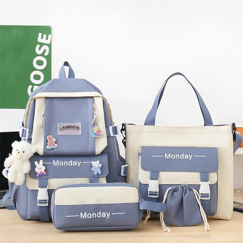 Set of blue and beige school bags with 'Monday' labels on a wooden surface.