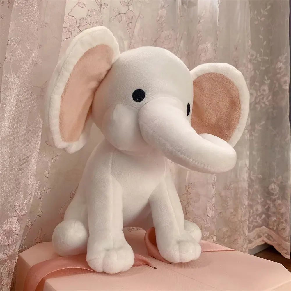 Plush elephant toy with pink accents 