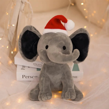 Plush elephant toy wearing a Santa hat.