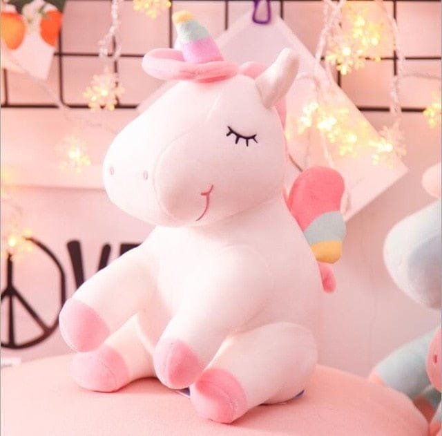 Plush unicorn toy with a rainbow horn.