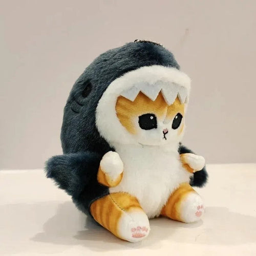 Plush toy resembling a cat in a shark costume
