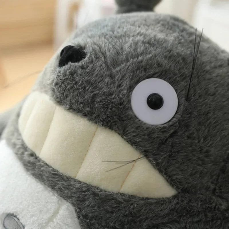 Close-up of a plush toy resembling a character with a large mouth and wide eyes.