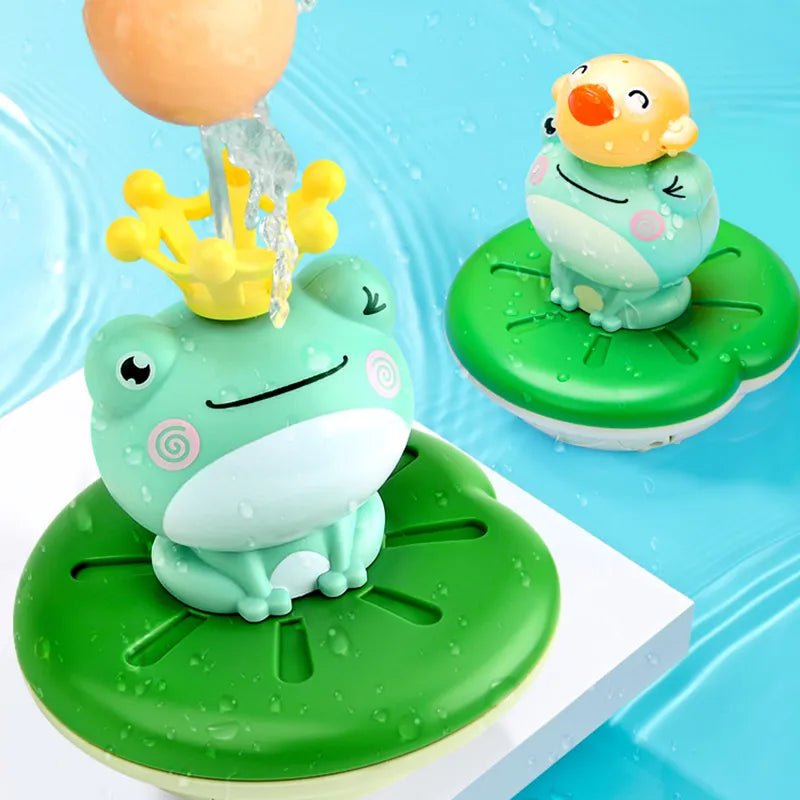 Two frog-shaped bath toys on green platforms.