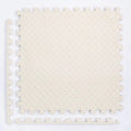 Beige interlocking foam mat.
