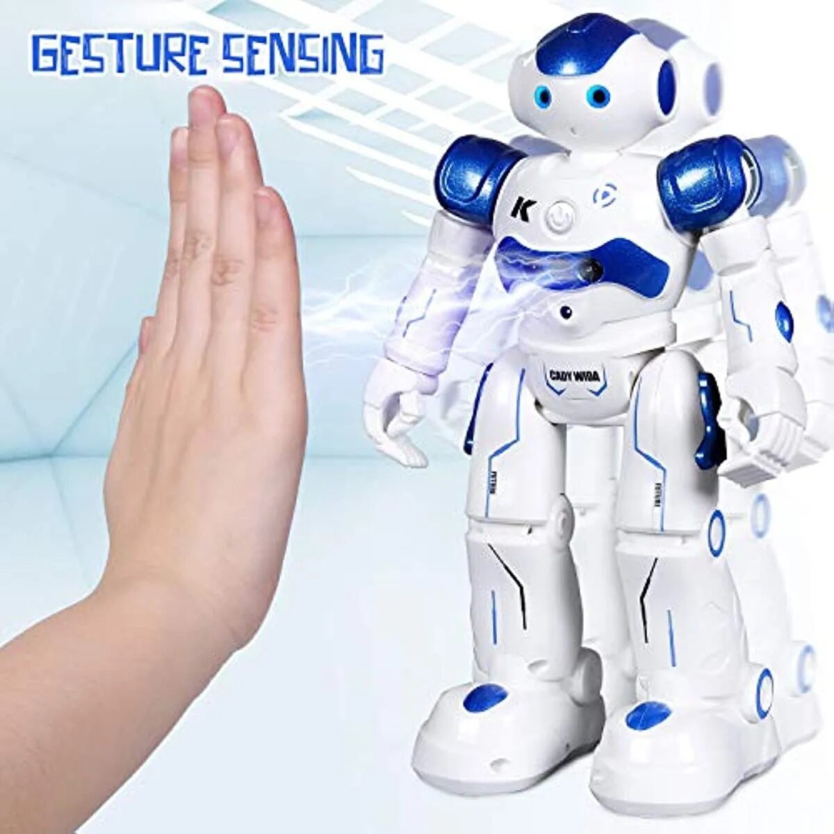 White and blue robot toy with gesture sensing feature, hand reaching towards it.