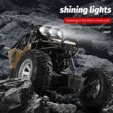 Toy off-road vehicle with large wheels on rocky terrain, featuring text about exploring in the dark.