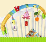 Colorful baby crib arch with hanging toys in a crib