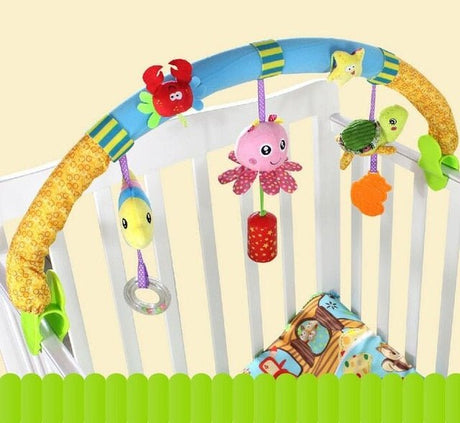 Colorful baby crib arch with hanging toys in a crib