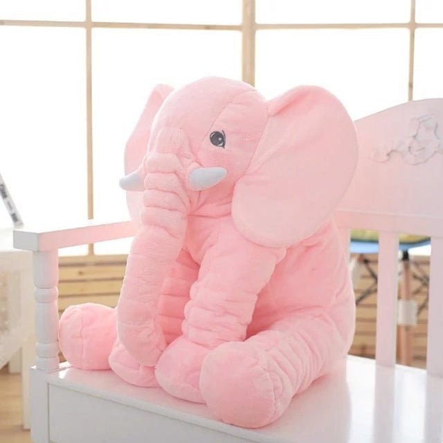 Large pink elephant plush toy.