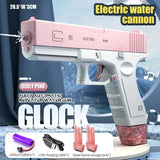Pink and white electric water cannon with water being sprayed, labeled 'Glock'.