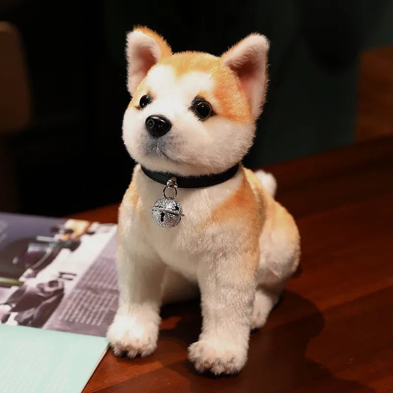Plush toy dog with a bell on a wooden surface