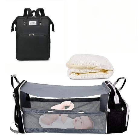 Black backpack, white mattress, and gray baby crib 