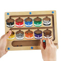 Color sorting toy with wooden frame and labeled containers filled with colored beads.