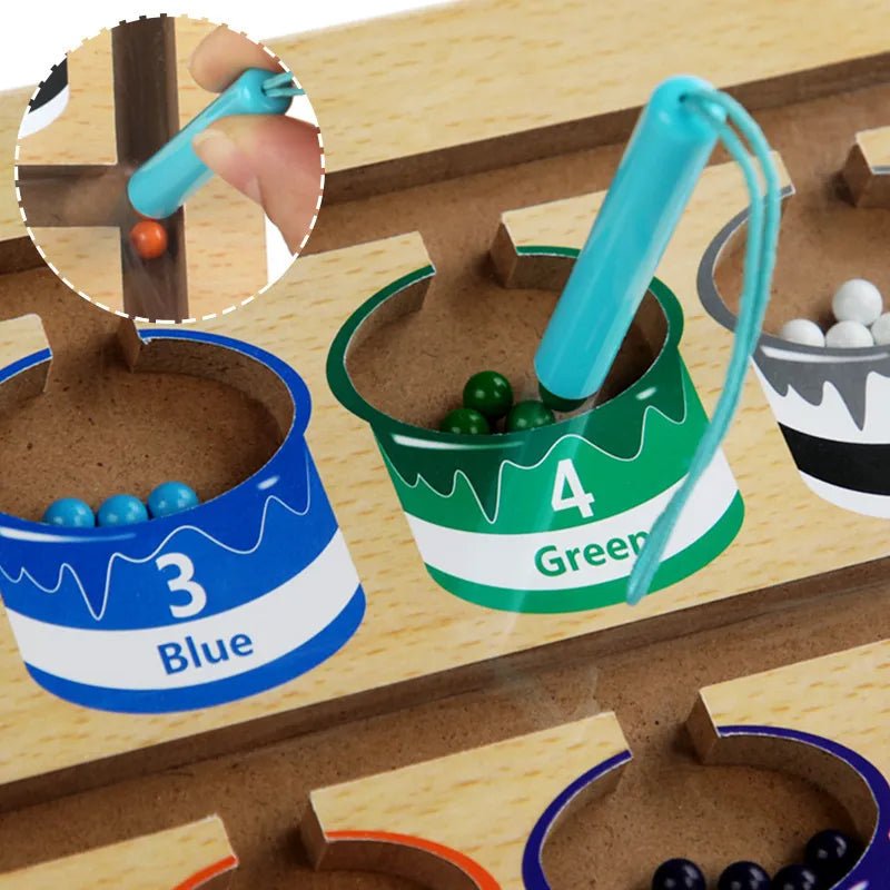 Children's educational toy with colored cups and marble sorting mechanism