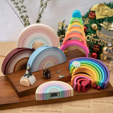 Colorful wooden rainbow toys on a wooden stand.