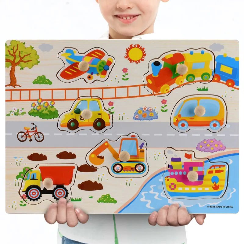 Child holding a wooden puzzle with colorful transportation-themed pieces.