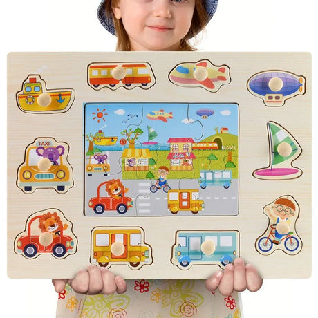 Child holding a wooden puzzle with various transportation-themed pieces.