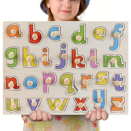 Child holding a colorful alphabet puzzle with letters from A to Z.