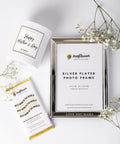 Silver-plated photo frame with two more gift items. 