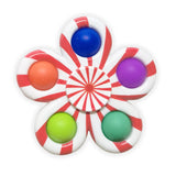 Colorful fidget spinner with red and white design.