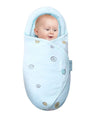 Baby wrapped in a light blue swaddle with buttons.