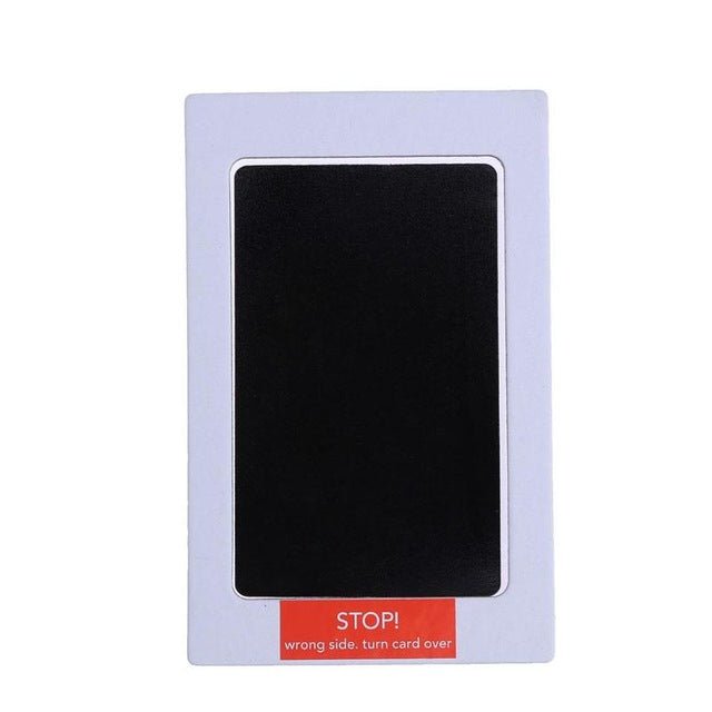 Black card with 'STOP!' label in a purple frame.