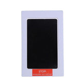 Black card with 'STOP!' label in a purple frame.